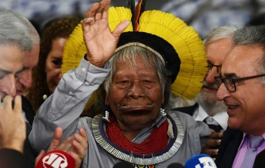 Brazilian indigenous leader Raoni Metuktire gestures during a press conference at the Brazilian Congress Lower House in Brasilia