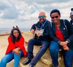 Betty Kyalo with Gilad Millo and a fan at KICC roof top