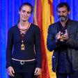 Migrant rescue ship captain Carola Rackete is given a medal from Catalonia's regional parliament alongside Proactiva Open Arms founder Oscar Camps
