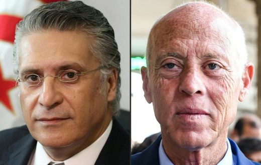 Tunisia presidential runoff candidates Nabil Karoui, (L) a media magnate jailed on corruption charges, and law professor Kais Saied