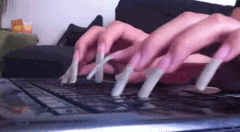 Typing with acrylics (giphy)