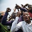 The march was called to protest the DR Congo constitutional court's invalidation of the election of about 20 opposition lawmakers