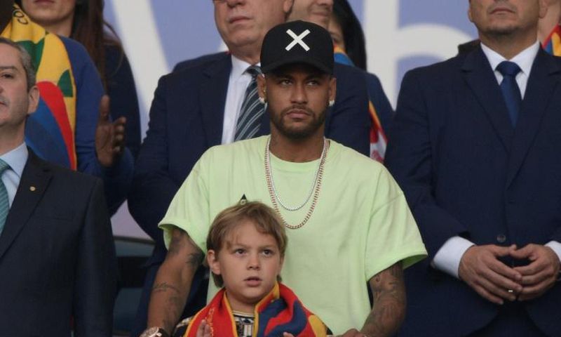 Injured Brazil football star Neymar, with his son Davi Lucca, watches the Copa America final where his team-mates showed he's replaceable