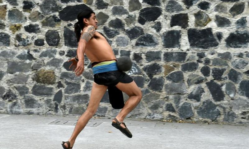 A man plays a pre-Columbian ballgame called "ulama," a ceremonial sport that dates back 3,500 years and is experiencing a renaissance in Mexico City