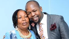 Alex Mwakideu with his mother