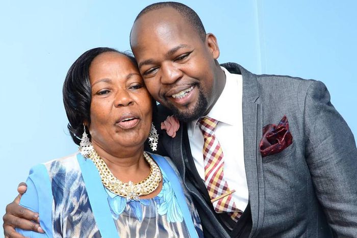 Alex Mwakideu with his mother