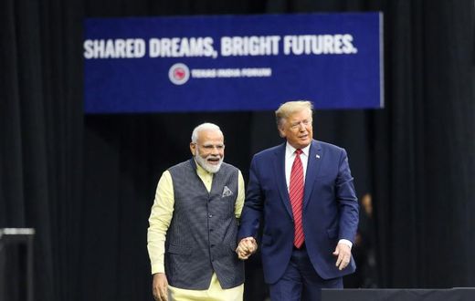 Indian Prime Minister Narendra Modi and US President Donald Trump hold hands at the event in Houston billed as the largest gathering by a foreign leader other than the pope in the United States