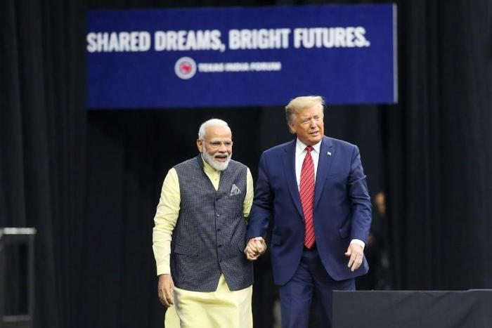 Indian Prime Minister Narendra Modi and US President Donald Trump hold hands at the event in Houston billed as the largest gathering by a foreign leader other than the pope in the United States