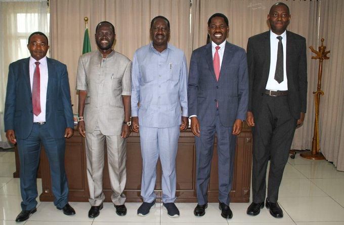 Trade CS Peter Munya receives advise from Raila Odinga during meeting at Capitol Hill