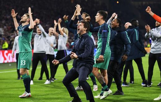Time to go again: Tottenham players manager Mauricio Pochettino (centre) celebrated a famous Champions League semi-final win at Ajax in May