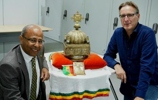 The ornate gilded copper crown, featuring images of Jesus and the Apostles, was unearthed after refugee-turned-Dutch-citizen Sirak Asfaw (L) contacted Dutch 'art detective' Arthur Brand (R)