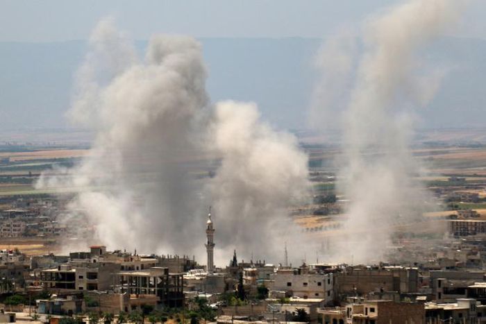 Smoke rises after a reported Syrian regime air strike on the town of Khan Sheikhun in Idlib province on on May 29, 2019
