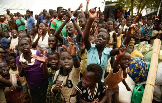 Young refugees from the Democratic Republic of Congo wait to be registered at the Kyangwali Refugee Settlement in western Uganda, on December 10, 2018