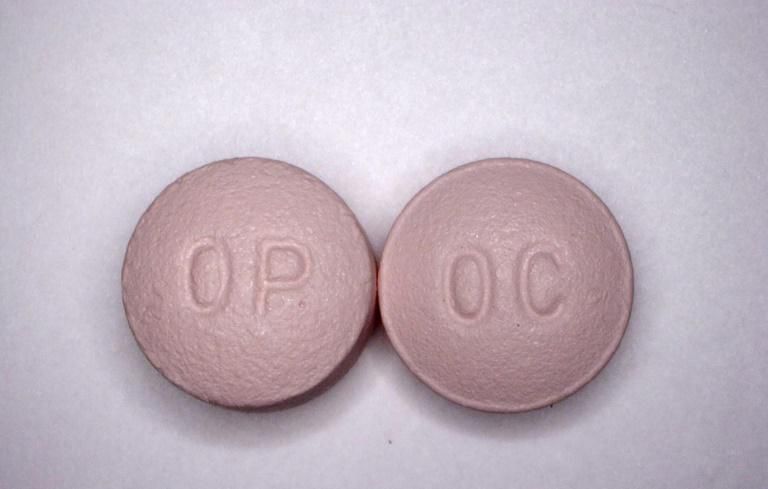 This undated handout file photo obtained courtesy of the US Drug Enforcement Administration shows 20 mg pills of the opioid painkiller OxyContin