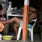 Migrants from Haiti and African countries stuck in the Mexican town of Tapachula do menial work to get by, such as giving pedicures