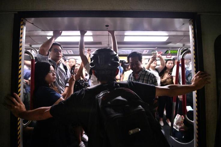 Protesters prevented the doors of subway trains closing