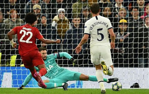 Serge Gnabry (L) beats Hugo Lloris in the Tottenham goal to complete his hat-trick - he scored four overall as Bayern Munich romped to a 7-2 win in north London