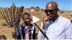 Larry Madowo eating Mouse