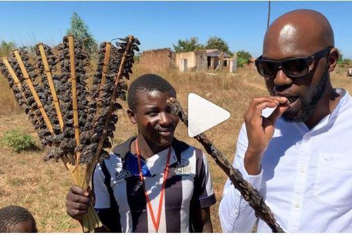 Larry Madowo eating Mouse