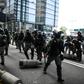 Police clear barricades left by protestors. Clashes between police and activists were less intense than at the start of October when the city was virtually shut down