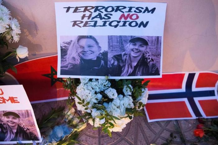 Flowers, pictures and flags in tribute to two young Scandinavian women killed while hiking in Morocco in December 2018