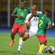 Ghana captain Andre Ayew (C) is outnumbered during an Africa Cup of Nations match against Cameroon in Egypt