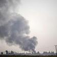 Smoke rises from the Syrian town of Tal Abyad after Turkish bombings
