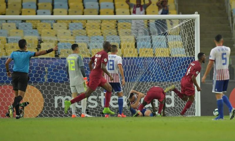 Qatar's players celebrate after Boualem Khoukhi scores the equalizer in their 2-2 Copa America draw with Paraguay