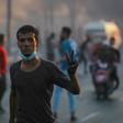 An Iraqi demonstrator flashes the victory sign during a demonstration in Baghdad Saturday