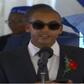 Andrew Kenneth lights up mourners at his grandmother, Rahab Muhuni's burial in Kirwara Gatundu