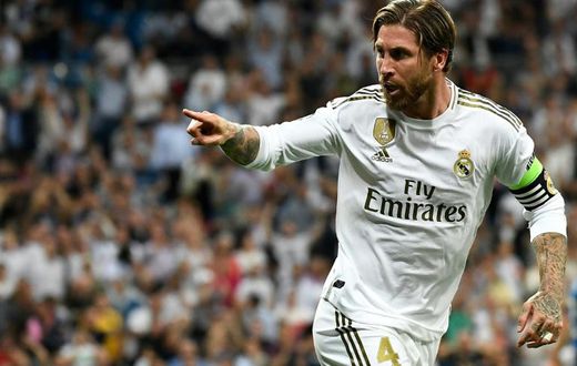 Real Madrid's Spanish defender Sergio Ramos celebrates after scoring a goal during theChampions league Group A 2-2 fdraw with Club Brugge