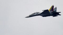 A Venezuelan Air Force Russian-made SU-30 fighter, like this one pictured over Caracas in 2013, is accused of jeopardizing the safety of the US crew and aircraft