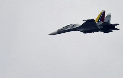 A Venezuelan Air Force Russian-made SU-30 fighter, like this one pictured over Caracas in 2013, is accused of jeopardizing the safety of the US crew and aircraft