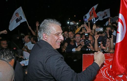 Tunisia's presidential candidate Nabil Karoui is greeted by his supporters after being released from Mornaguia prison near the capital Tunis ahead of Sunday's runoff