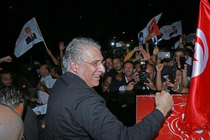 Tunisia's presidential candidate Nabil Karoui is greeted by his supporters after being released from Mornaguia prison near the capital Tunis ahead of Sunday's runoff
