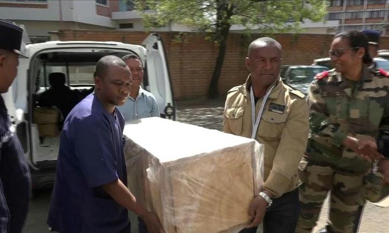 The coffin containing the remains of British Cambridge University student Alana Cutland was carried out from the morgue