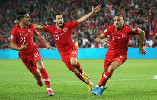 Turkey's forward Cenk Tosun (R) after scoring a late winner over Albania on Thursday