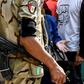An Egyptian soldier speaks with a woman, as a youth behind her wears a t-shirt that reads "do the right thing", in Shubra on April 20, 2019; Egypt's parliament has approved amendments to a law that rights groups say imposes strict curbs on NGOs