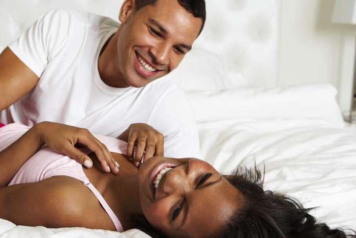 Couple having a good time in bed.