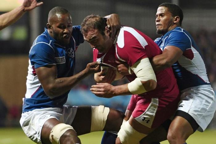 Namibia scrum-half Eugene Jantjies (R) playing against Georgia in the 2015 Rugby World Cup in England
