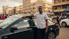 An AI-generated image of a man standing next to his car