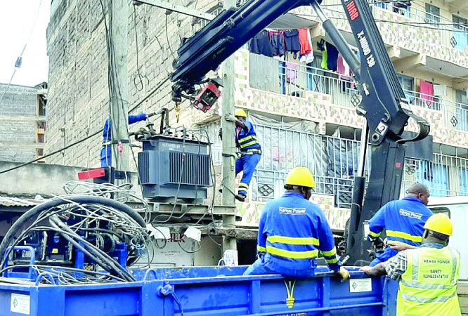 Kenya Power staff replacing a transformer