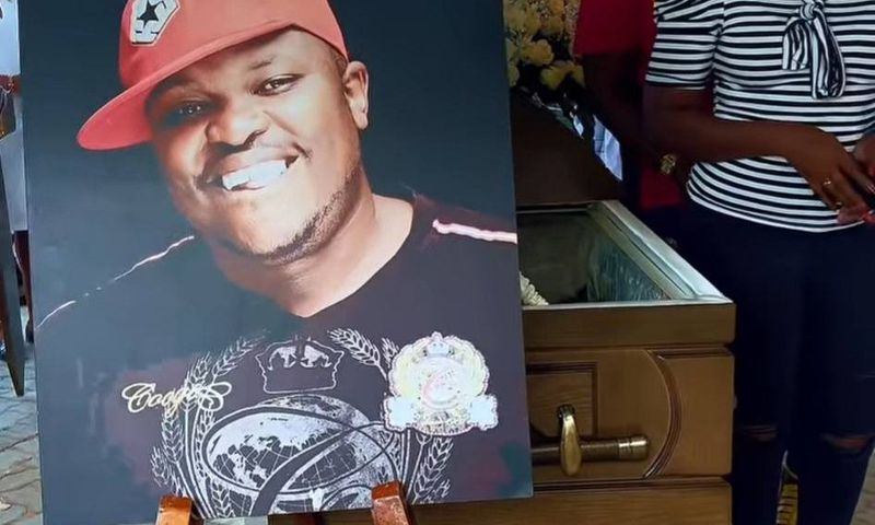 An image and casket of the late Xavier Jerry Nato