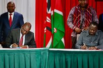 President William Ruto and Raila Odinga signing a political pact at KICC on March 7, 2025 with DP Kithure Kindiki and Senator Ledama Ole Kina standing in the background