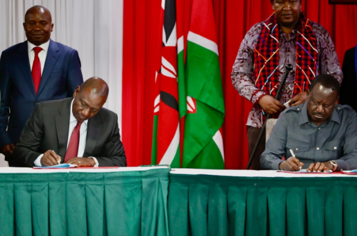 President William Ruto and Raila Odinga signing a political pact at KICC on March 7, 2025 with DP Kithure Kindiki and Senator Ledama Ole Kina standing in the background