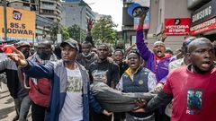 Good Samaritans rushing injured protestor to hospital. Photo/Courtesy