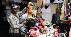 A young man selling thrift clothes [Image Credit: Business Today]