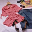 A thrift dress is on display for online sale