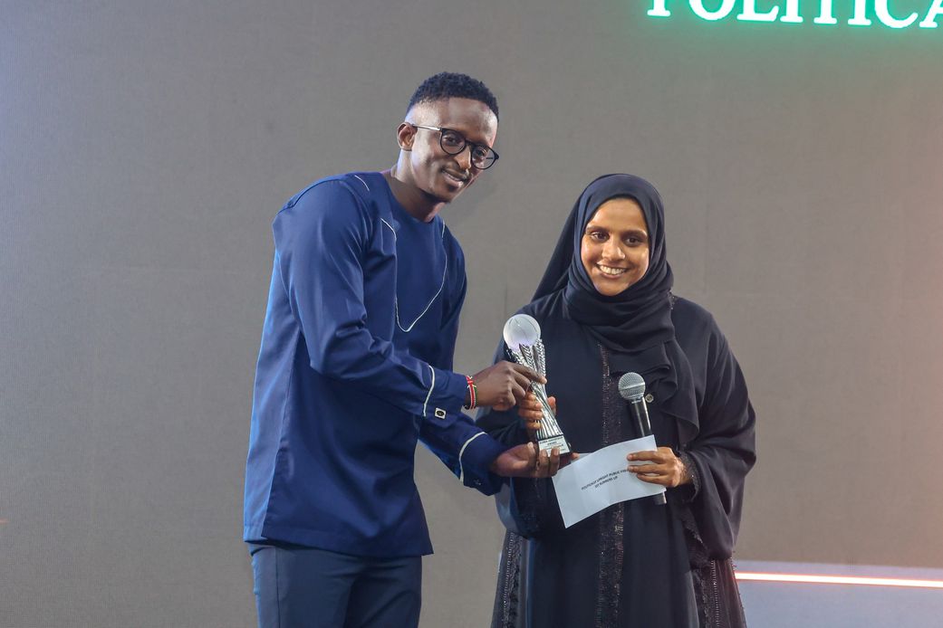 Njugush receiving his award