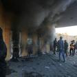 Smoke billows from the entrance of the US embassy in Baghdad after pro-Iran protesters tried to break into the building during a rally to vent anger over deadly US air strikes